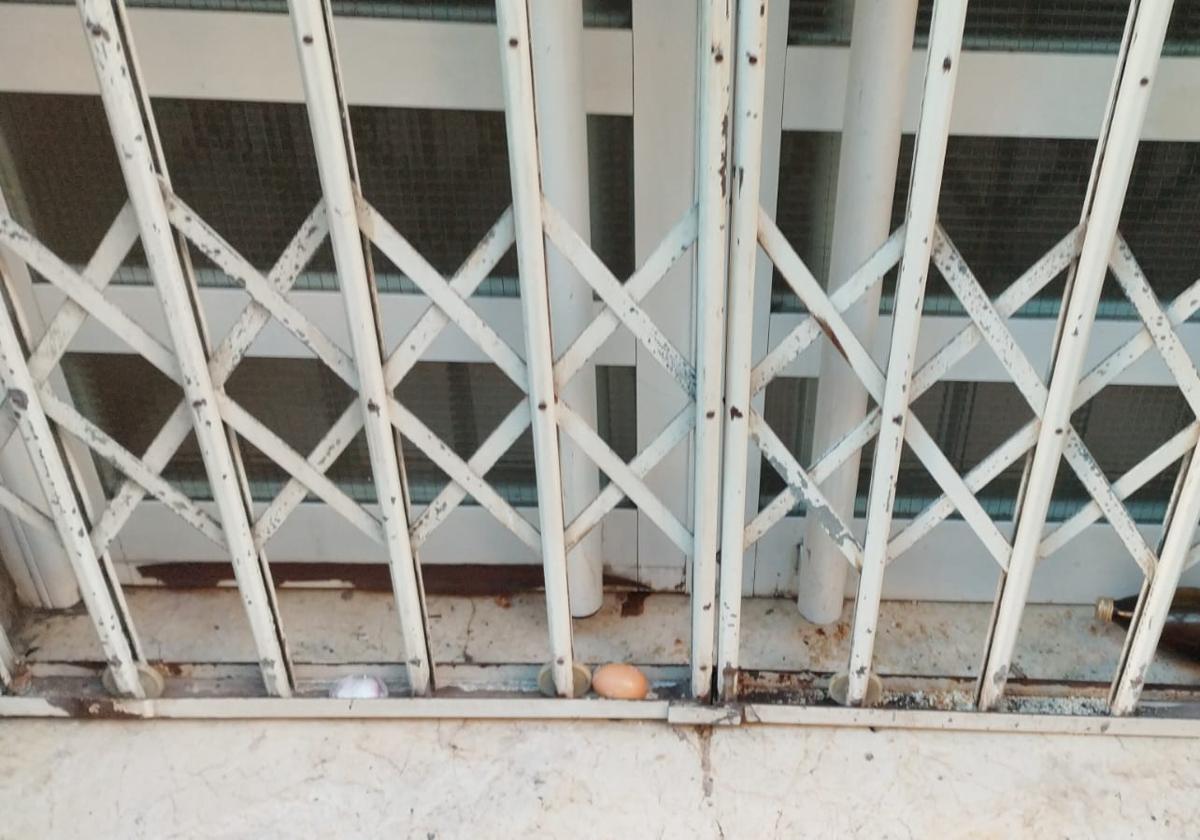 The door of the socialist group with remnants of the vandalism.