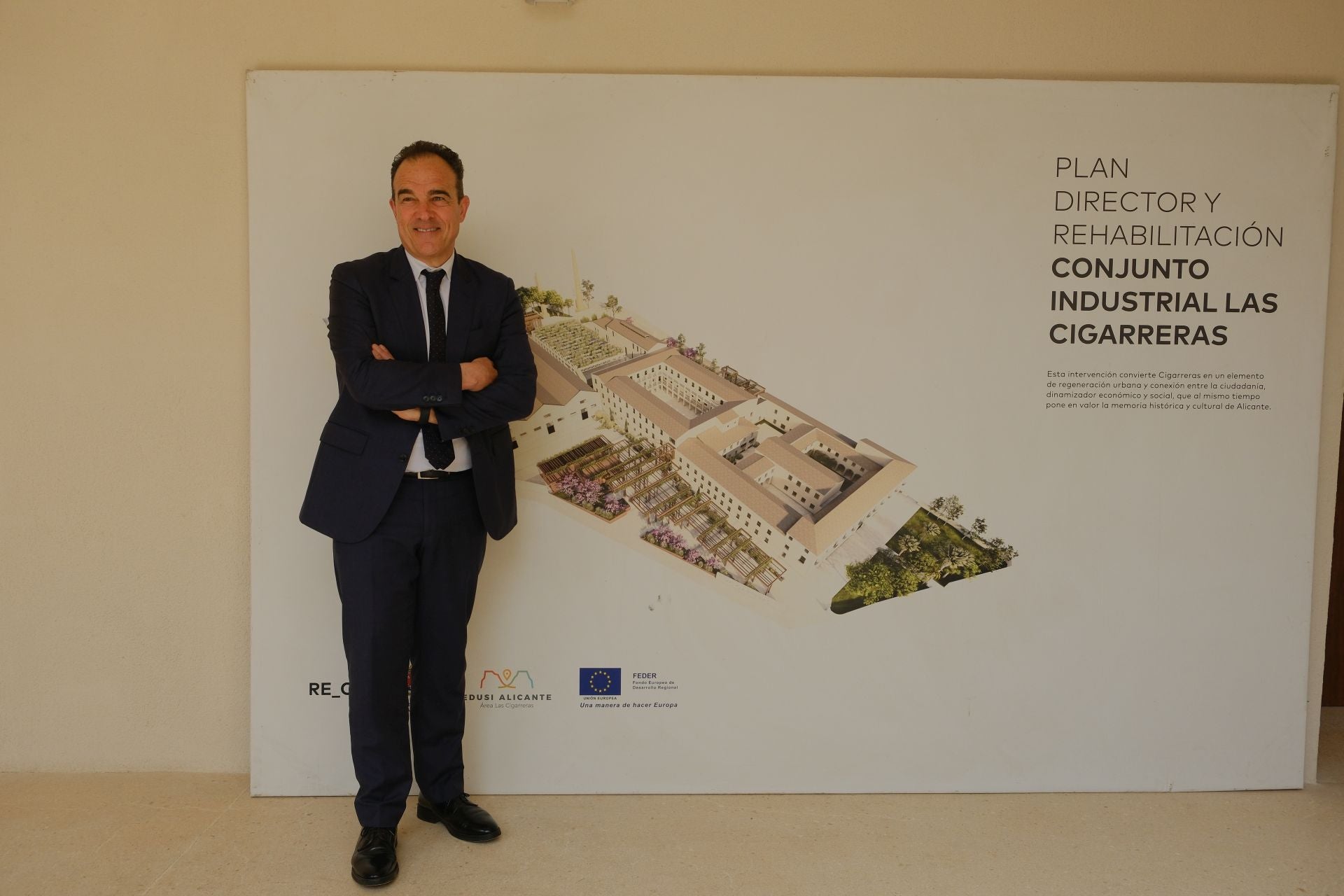 Councillor Antonio Peral next to a map of the complex. The rehabilitated area includes the two cloisters on the right.