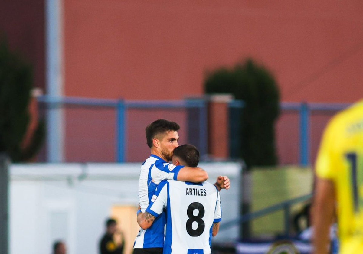 Coscia and Artiles embrace after scoring the equaliser in Villarreal.