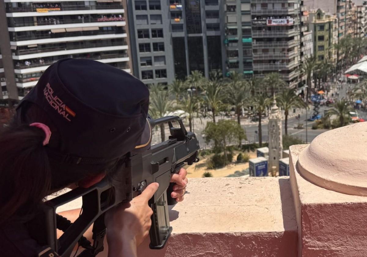 A UPR marksman watches over the mascletà from one of the buildings in Luceros.