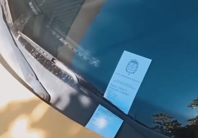 'Fake fine' placed on a vehicle's windshield.