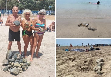 Los bañistas del Postiguet se ven obligados a retirar rocas tras las obras del espigón ante la inacción de Costas
