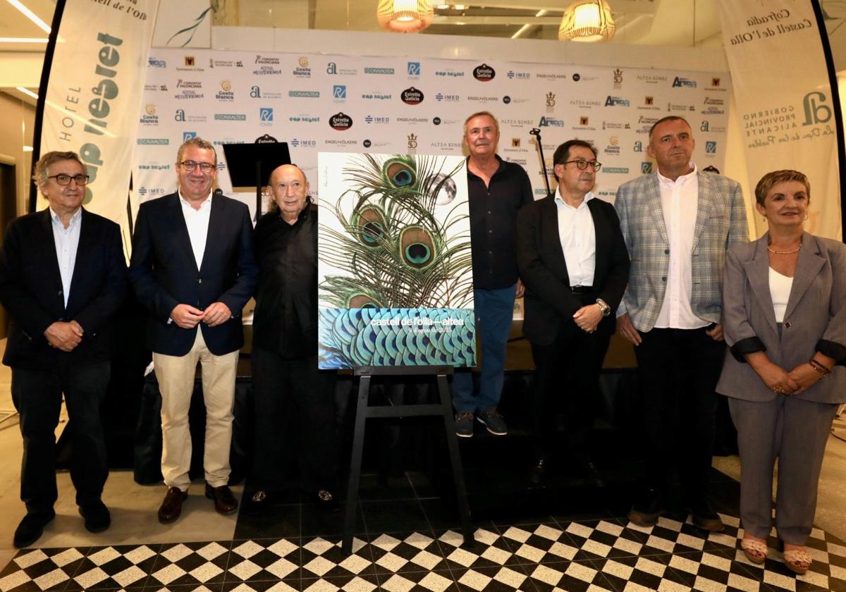 Authorities pose with the Castell de l'Olla poster, designed by Francis Montesinos.