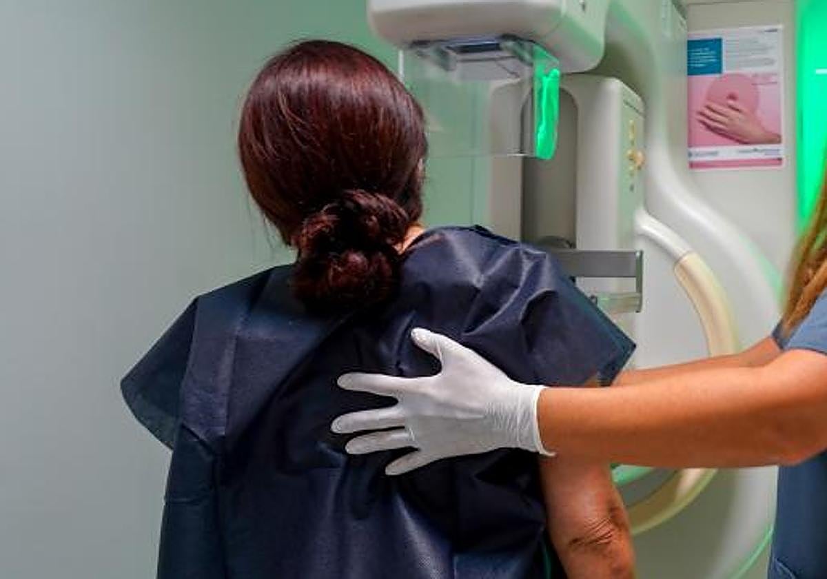 A patient undergoing a mammogram.