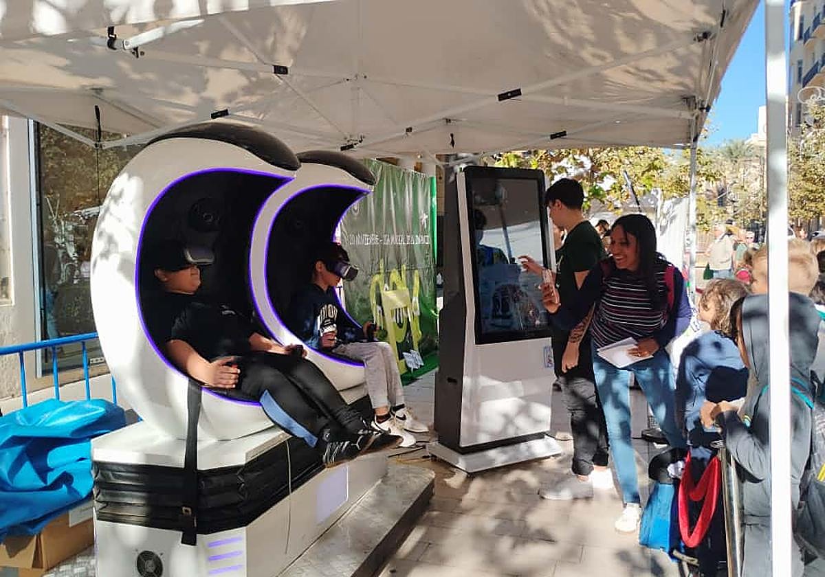 Children enjoy a virtual reality attraction.