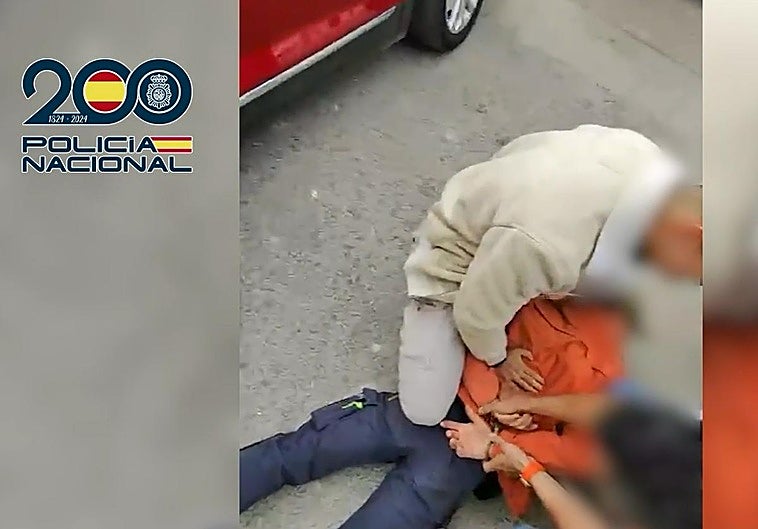 Moment of arrest captured by police officers.